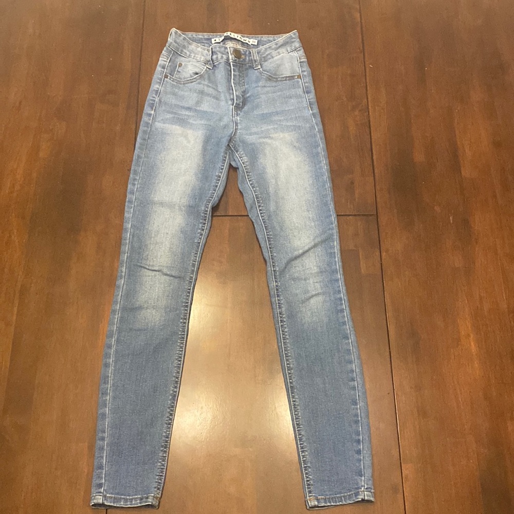 Skinny blue jeans call, lightly worn, and straight leg